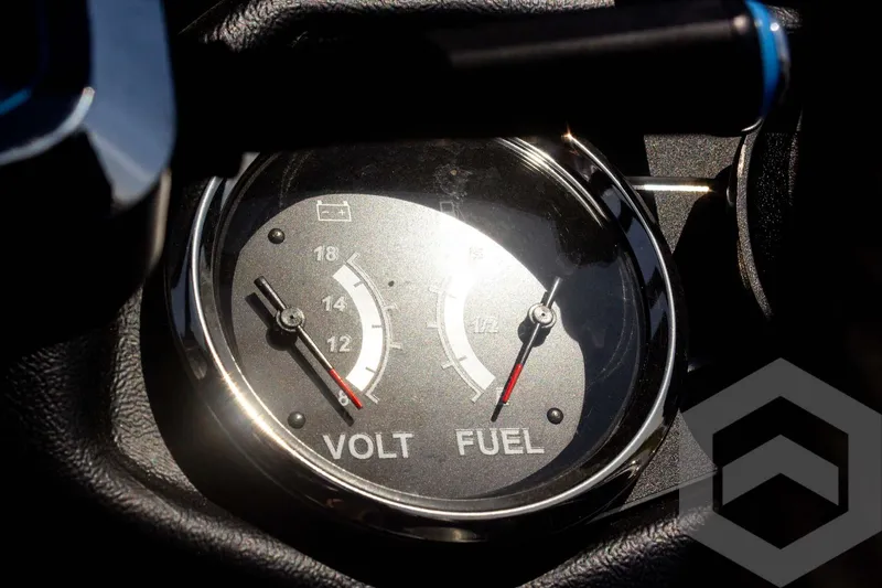 Slide: The Image of 2023 Skeeter ZXR 20 dashboard showing volt and fuel gauges. - 37
