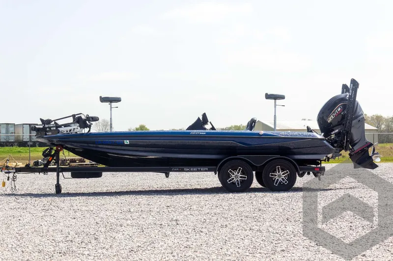 Slide: The Image of 2023 Skeeter ZXR 20 boat on trailer, side view, outdoors. - 8