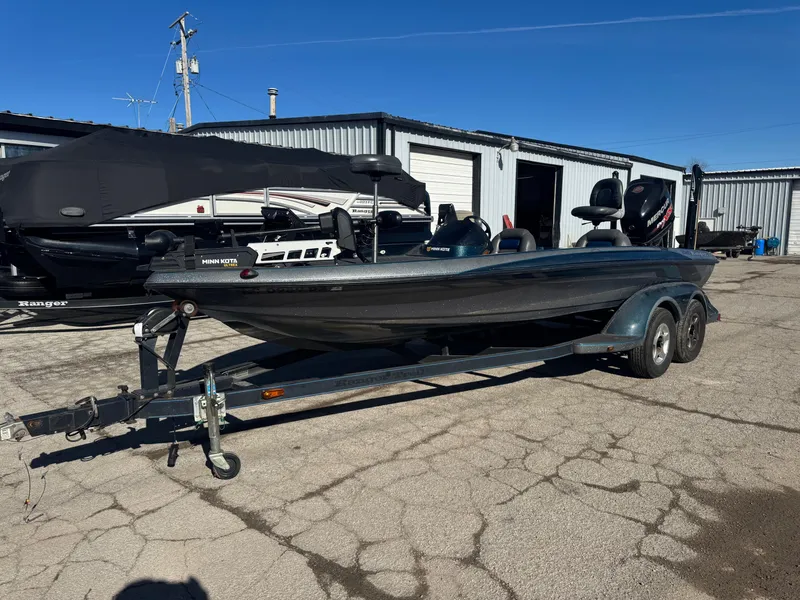 Slide: The Image of 2000 Ranger 520SVX Comanche boat on trailer in outdoor storage area. - 4