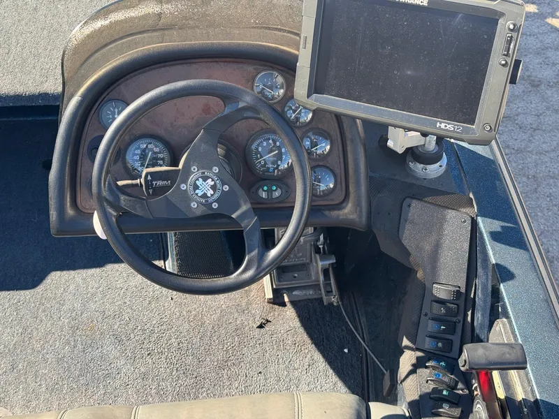 Slide: The Image of Steering console of 2000 Ranger 520SVX Comanche boat with gauges and navigation system. - 8