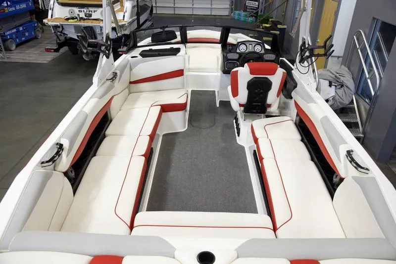 Slide: The Image of 2020 Axis A24 boat interior with white and red seating, spacious layout. - 10