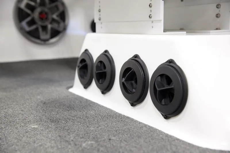 Slide: The Image of 2020 Axis A24 boat interior with black air vents and speaker. - 15