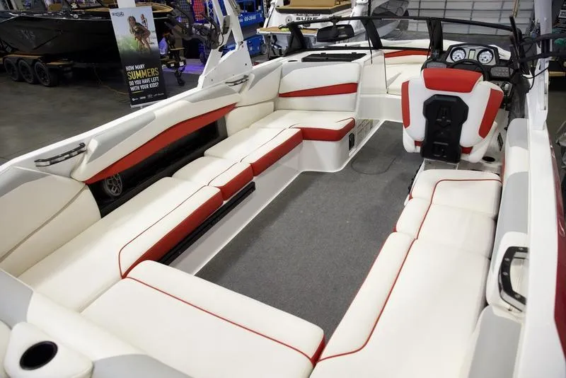 Slide: The Image of 2020 Axis A24 boat interior with white and red seating, spacious layout. - 16