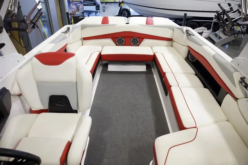 Slide: The Image of 2020 Axis A24 boat interior with white and red seating, featuring built-in speakers. - 17
