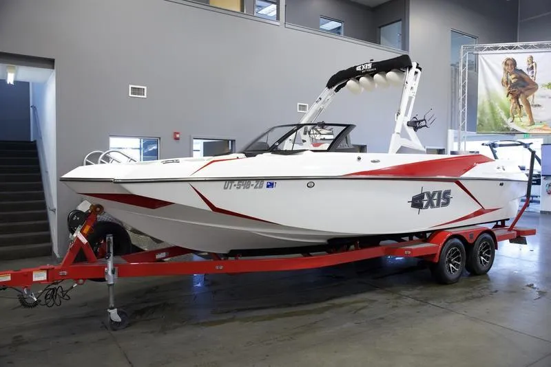 Slide: The Image of 2020 Axis A24 boat on red trailer in showroom. - 3