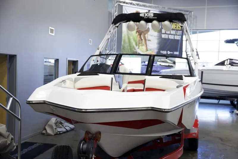 Slide: The Image of 2020 Axis A24 boat displayed indoors, featuring sleek design and modern seating. - 6