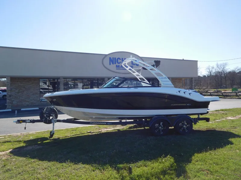 Slide: The Image of 2025 Chaparral 21 SSi boat on trailer outside dealership. - 0