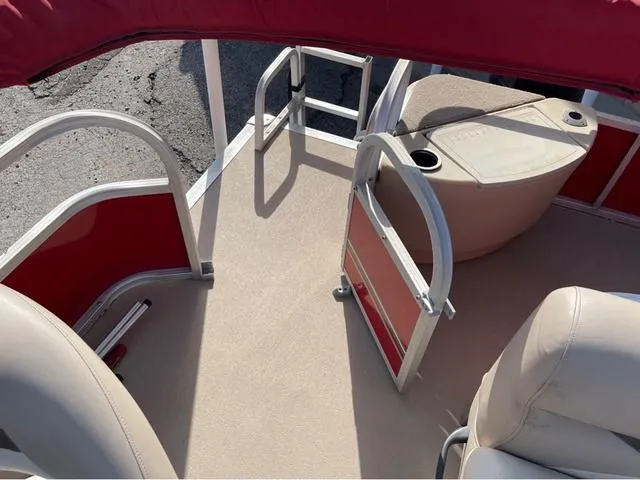 Slide: The Image of 2014 Sun Tracker BASS BUGY boat interior with red accents and seating. - 13
