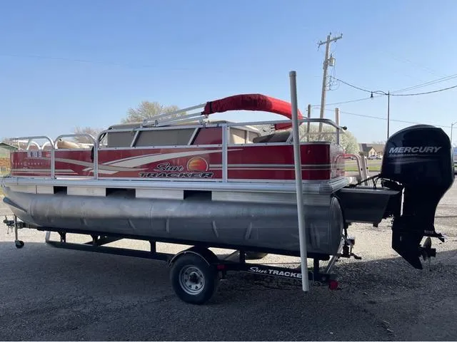 Slide: The Image of 2014 Sun Tracker BASS BUGY pontoon boat with Mercury outboard motor on trailer. - 4