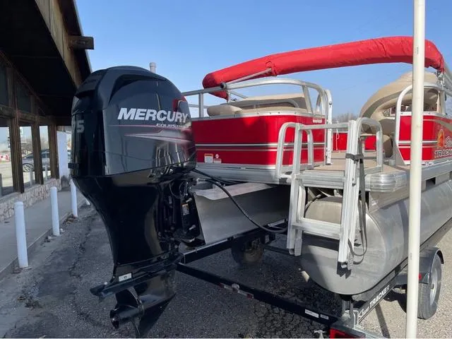 Slide: The Image of 2014 Sun Tracker BASS BUGY pontoon boat with Mercury outboard motor, red canopy, and trailer. - 6