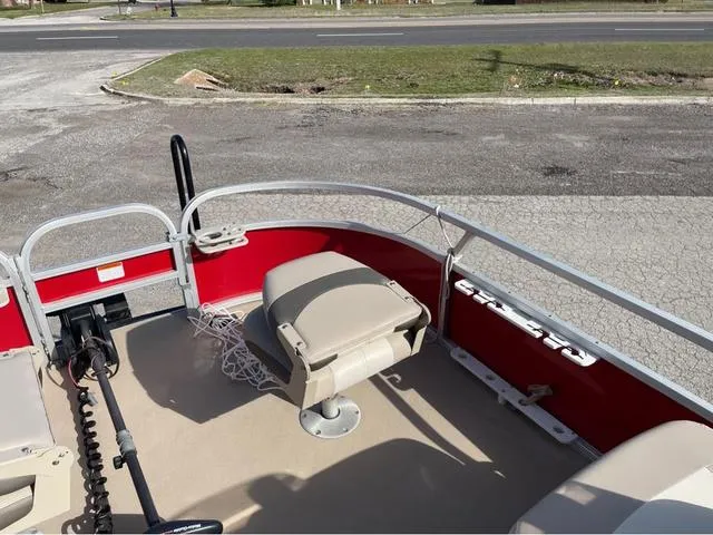 Slide: The Image of 2014 Sun Tracker BASS BUGY boat interior with seating and fishing equipment. - 9