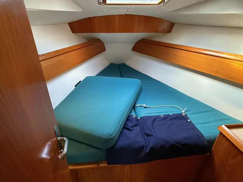 Slide: The Image of Cabin interior of 1999 Jeanneau Sun Odyssey 36.2 sailboat with blue cushions. - 17
