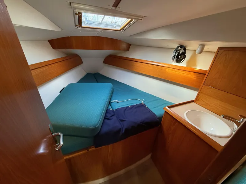 Slide: The Image of Cabin interior of 1999 Jeanneau Sun Odyssey 36.2 with bed and sink. - 18