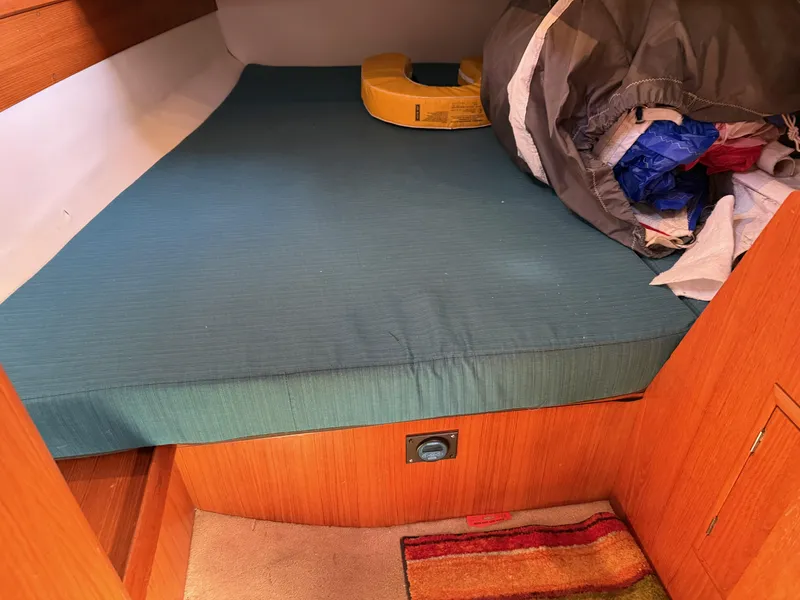 Slide: The Image of Cabin interior of 1999 Jeanneau Sun Odyssey 36.2 sailboat with bed and storage. - 21