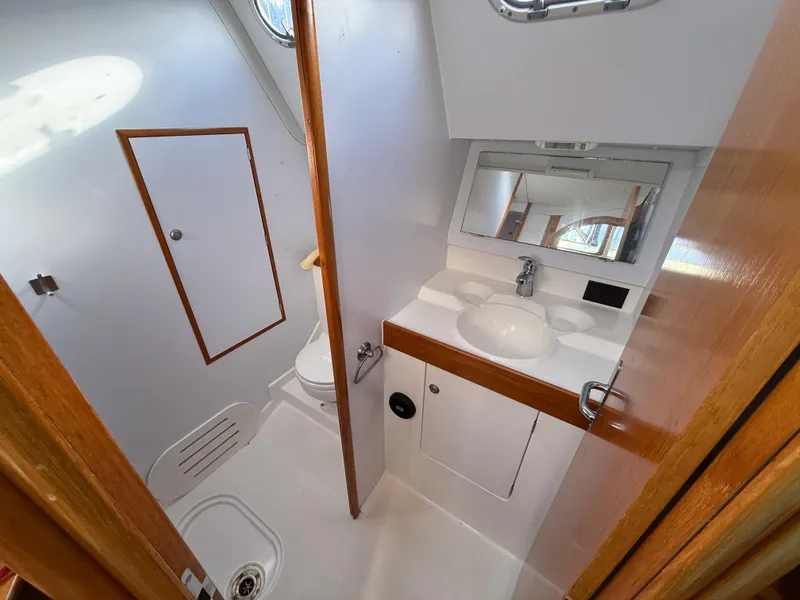 Slide: The Image of Interior of 1999 Jeanneau Sun Odyssey 36.2 yacht bathroom with sink and toilet. - 22