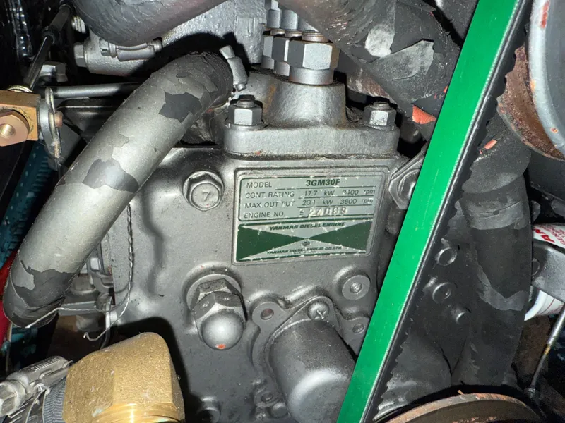 Slide: The Image of Engine compartment of a 1999 Jeanneau Sun Odyssey 36.2 sailboat, featuring a Yanmar 3GM30F engine. - 39