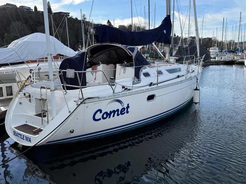 Slide: The Image of 1999 Jeanneau Sun Odyssey 36.2 sailboat named "Comet" docked in Seattle marina. - 7