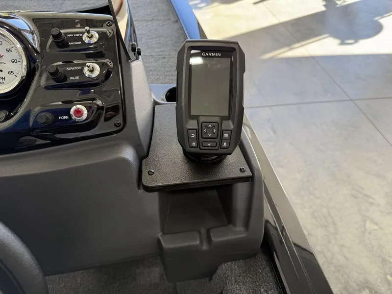 Slide: The Image of 2025 Tracker Pro 170 dashboard with Garmin device and control panel. - 13