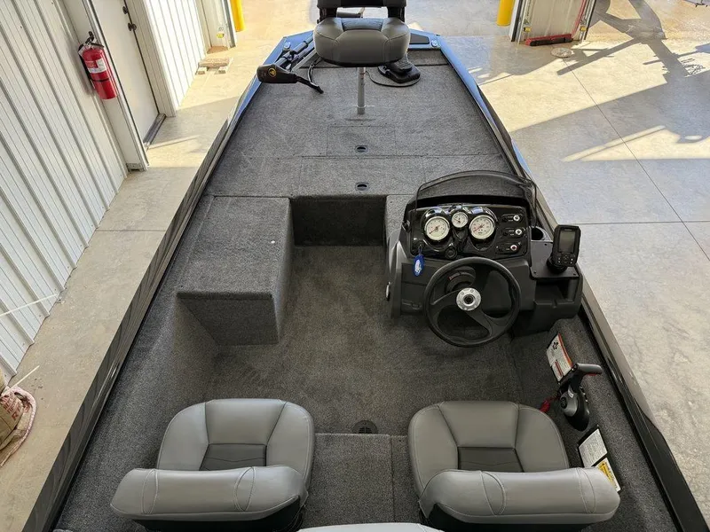 Slide: The Image of 2025 Tracker Pro 170 boat interior with steering console and seating. - 17