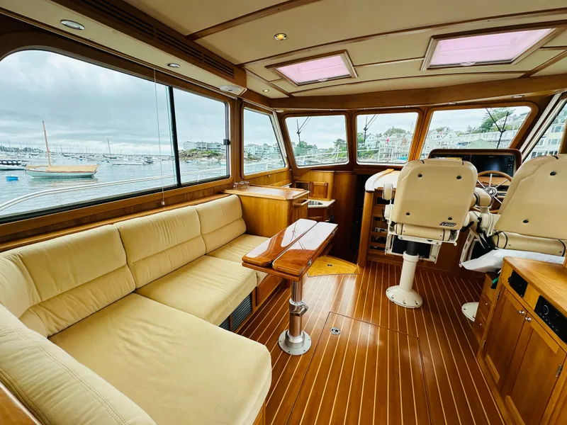 Slide: The Image of Luxurious interior of 2011 Sabre 40 Sedan yacht with leather seating and wooden flooring. - 17