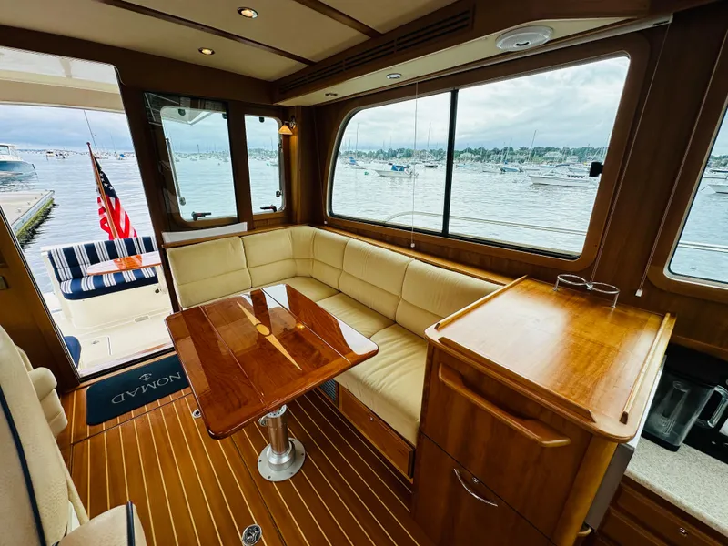 Slide: The Image of Interior of 2011 Sabre 40 Sedan yacht with wooden furnishings and waterfront view. - 19