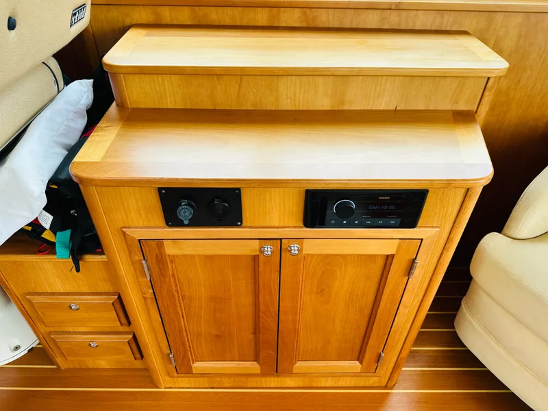 Slide: The Image of Wooden cabinet with control panel in 2011 Sabre 40 Sedan interior. - 22