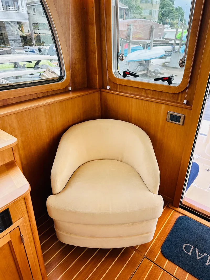 Slide: The Image of Beige chair in 2011 Sabre 40 Sedan yacht interior with wooden flooring. - 25