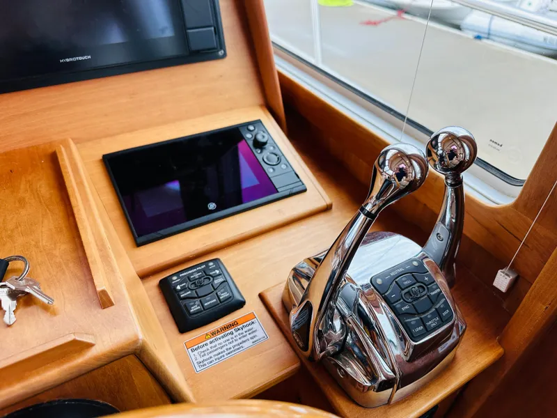 Slide: The Image of Control panel of a 2011 Sabre 40 Sedan yacht with dual throttle levers. - 33