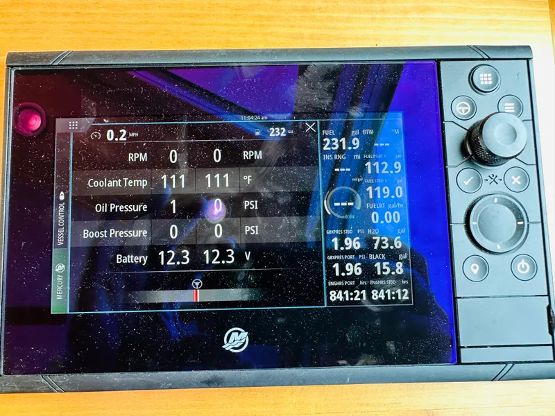 Slide: The Image of Boat control panel display showing engine metrics for a 2011 Sabre 40 Sedan. - 34