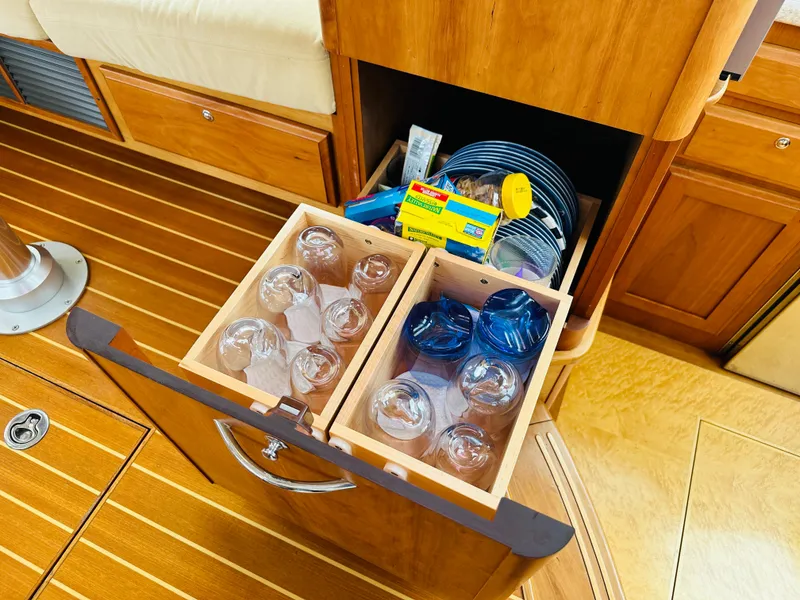 Slide: The Image of Storage drawer with glasses and plates in 2011 Sabre 40 Sedan yacht interior. - 37