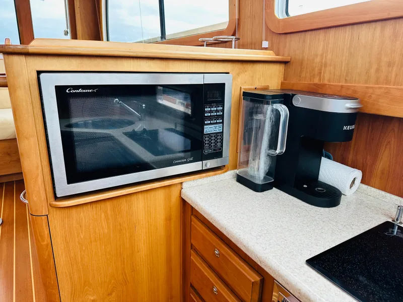 Slide: The Image of Galley area in 2011 Sabre 40 Sedan with microwave and coffee maker. - 39