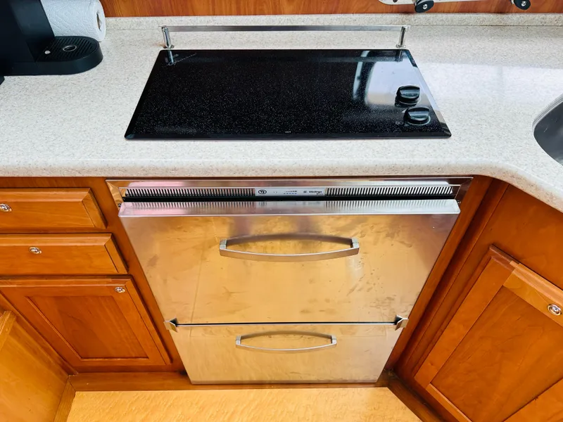 Slide: The Image of Stainless steel oven and stovetop in 2011 Sabre 40 Sedan yacht kitchen. - 40
