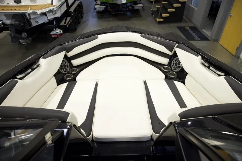 Slide: The Image of 2020 Axis A24 boat interior with white and black seating, showcasing modern design. - 13