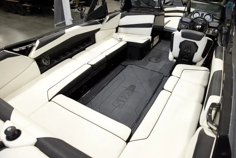 Slide: The Image of 2020 Axis A24 boat interior with spacious seating and modern dashboard. - 14