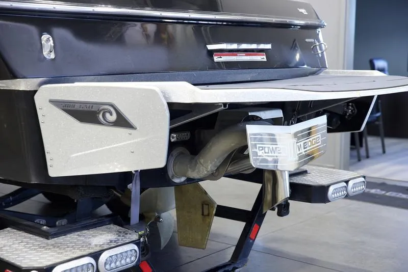 Slide: The Image of 2020 Axis A24 boat rear view with wakeboard features and LED lights. - 4