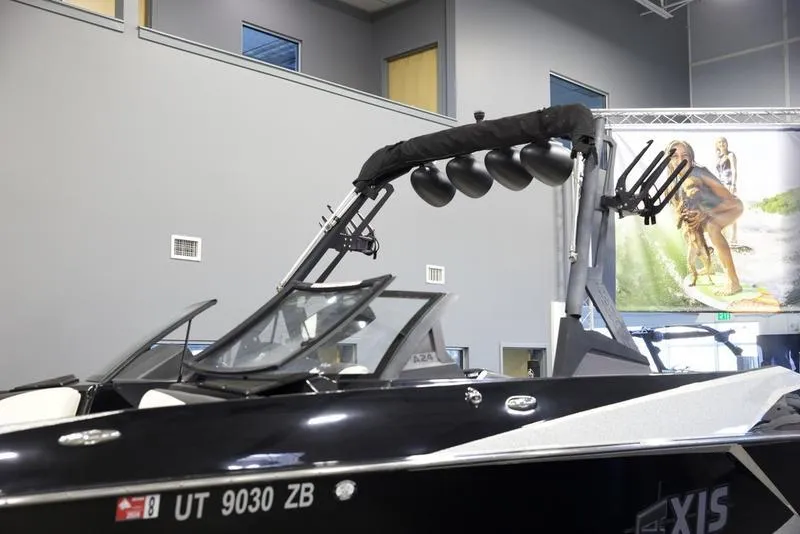 Slide: The Image of 2020 Axis A24 boat with wakeboard tower in showroom. - 6