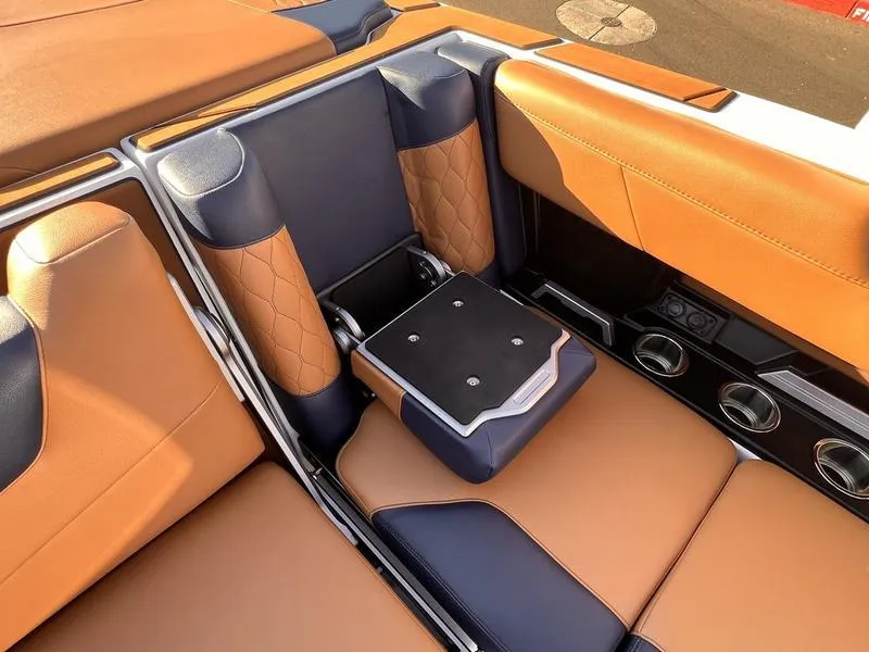 Slide: The Image of 2023 Malibu M220 interior with tan and black leather seats, featuring modern design and comfort. - 18