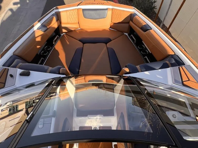 Slide: The Image of 2023 Malibu M220 boat interior with luxurious seating and modern design. - 19