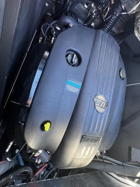 Slide: The Image of 2023 Malibu M220 engine compartment showcasing a powerful marine engine. - 22