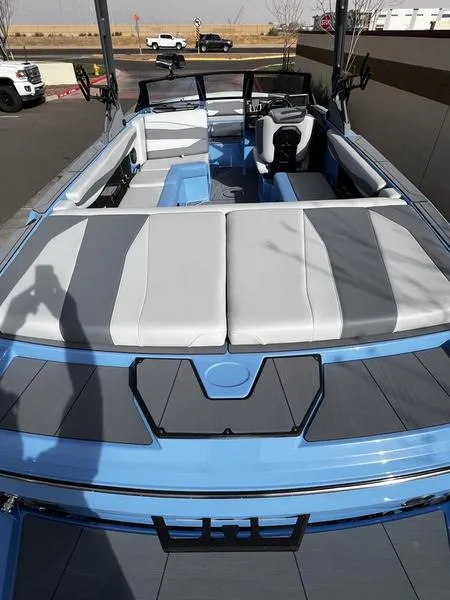 Slide: The Image of 2025 Axis A225 boat with sleek blue and gray interior design. - 10