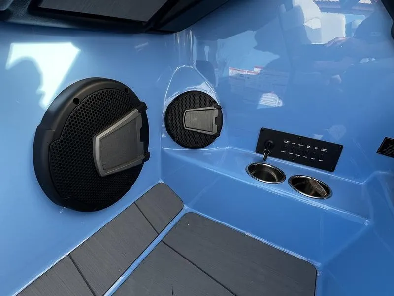 Slide: The Image of 2025 Axis A225 boat interior with speakers and control panel. - 14