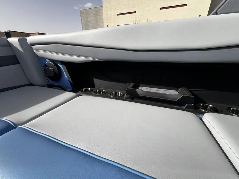 Slide: The Image of Interior of 2025 Axis A225 boat with seating and cup holders. - 19