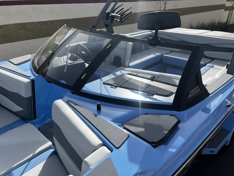 Slide: The Image of 2025 Axis A225 boat with sleek blue design and spacious seating. - 6
