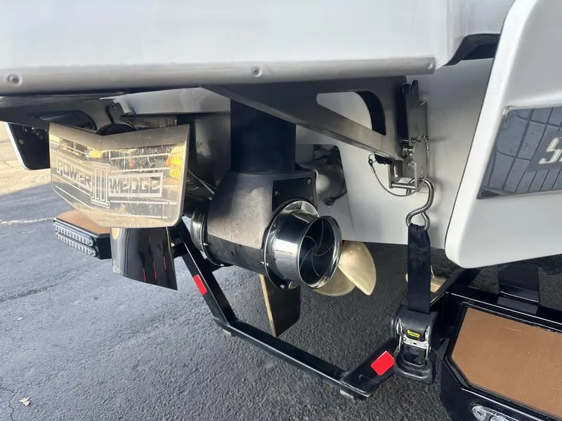 Slide: The Image of 2021 Malibu 24 MXZ boat stern with propeller and Power Wedge feature. - 5