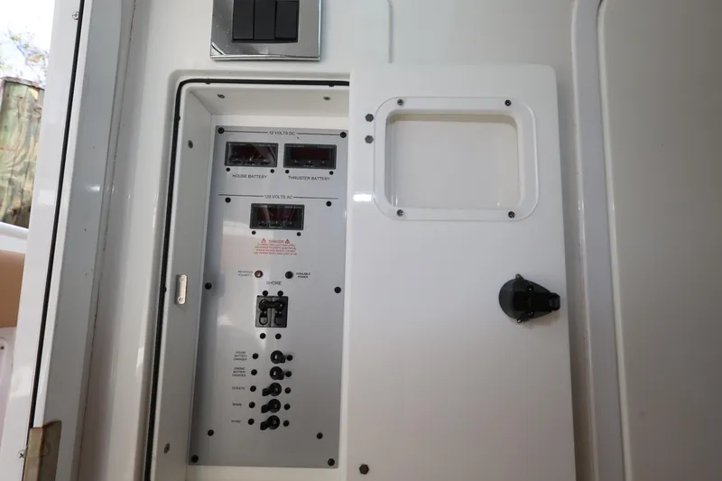Slide: The Image of Electrical panel inside 2020 HCB Speciale boat, featuring switches and meters. - 30