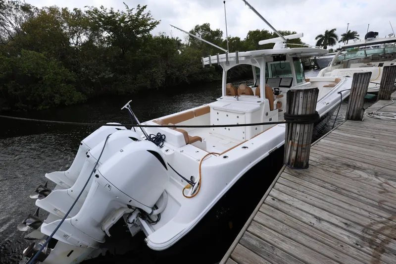 Slide: The Image of 2020 HCB Speciale boat docked, featuring sleek design and powerful engines. - 32