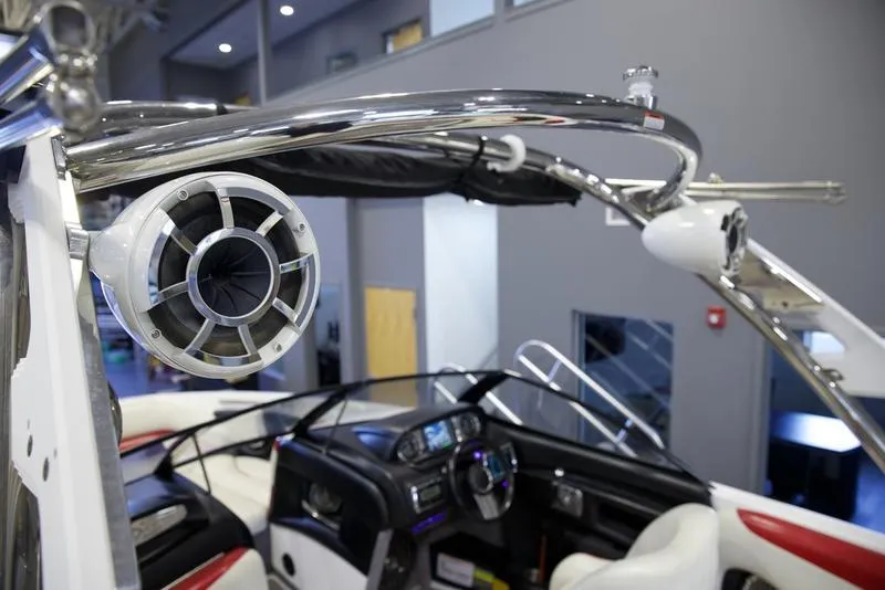 Slide: The Image of Interior of 2014 Malibu 247 LSV boat with speaker and steering wheel. - 7