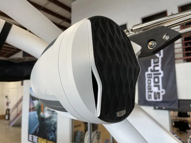 Slide: The Image of 2025 Malibu 23 MXZ boat speaker, white and black design, mounted on a metal frame. - 20