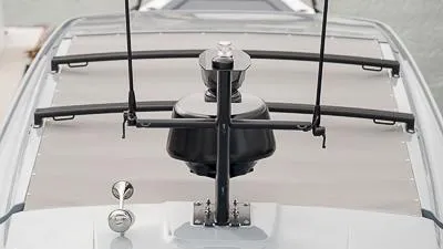 Slide: The Image of 2024 Axopar 37 XC Cross Cabin BRABUS Trim Wet Bar cruising on calm waters. - 6