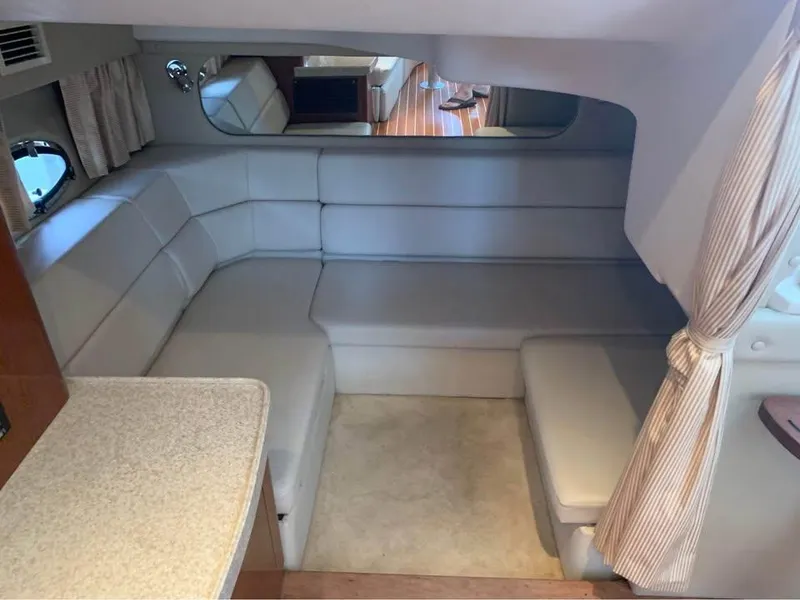 Slide: The Image of Interior of 2006 Regal Commodore 3560 IO yacht with plush seating and elegant decor. - 10